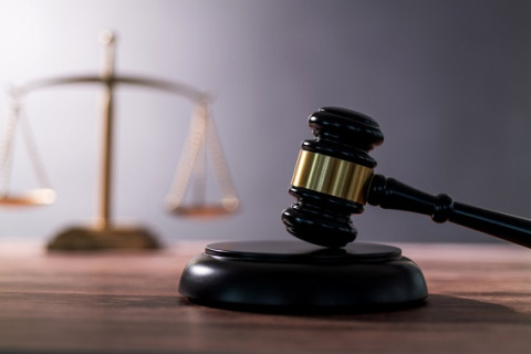 Gavel and scales of justice on the table