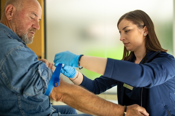 Nurse preparing a patient for a blood donation