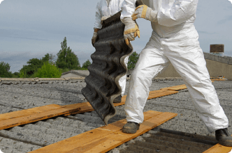 Workers safely remove asbestos from building